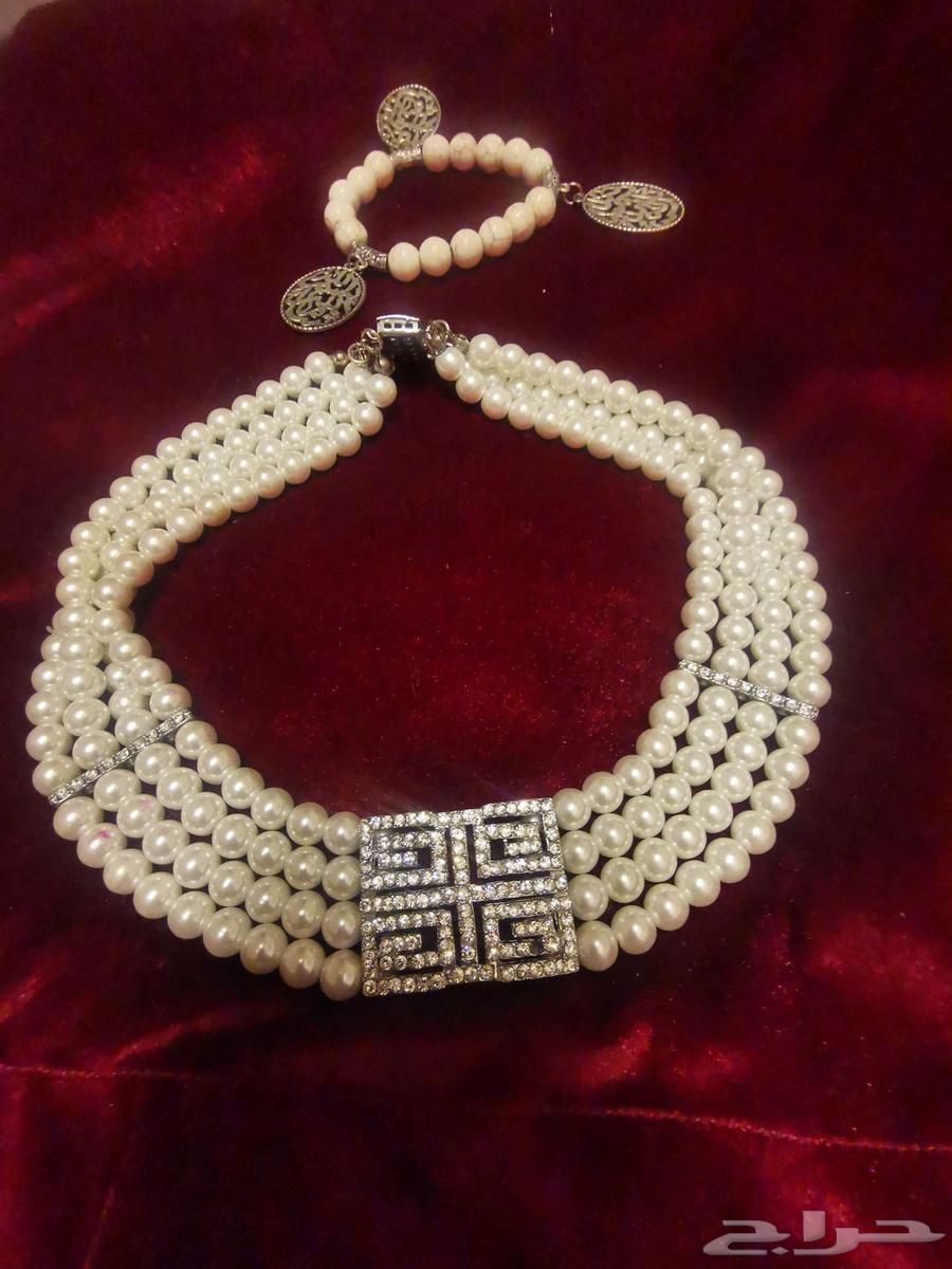 Luxurious evening dress, accessories, and a branded women's watch63220524671874111