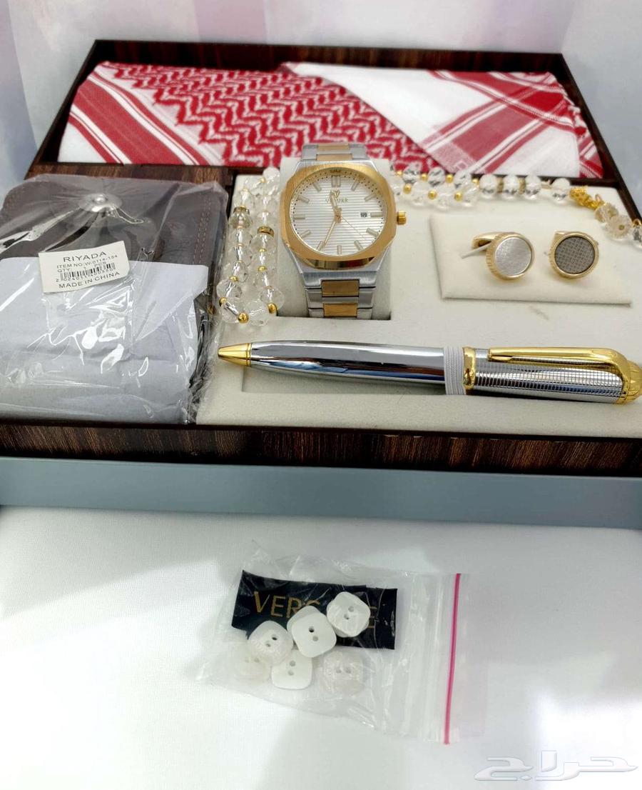 Fabric of a thobe with a shemagh and a watch set63172421995010112