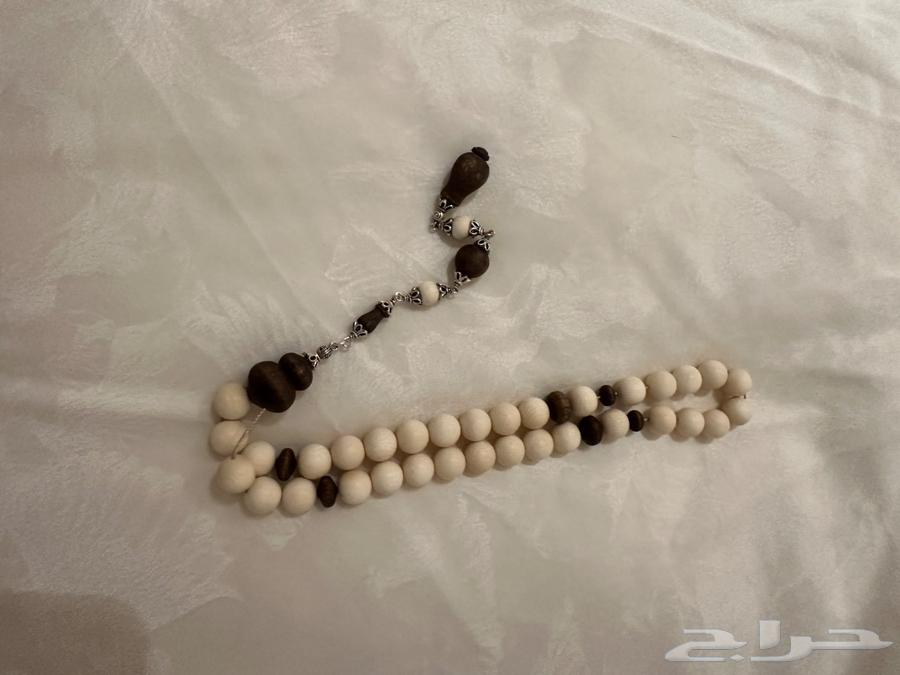 Swimming from ivory and moroccan oud wood and silver63152051655938113