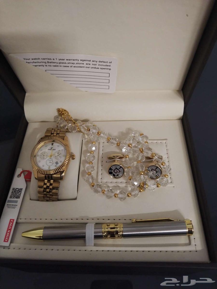 A luxury box suitable as a gift containing a rosary, a pen, a watch, and a bracelet63010245379585113