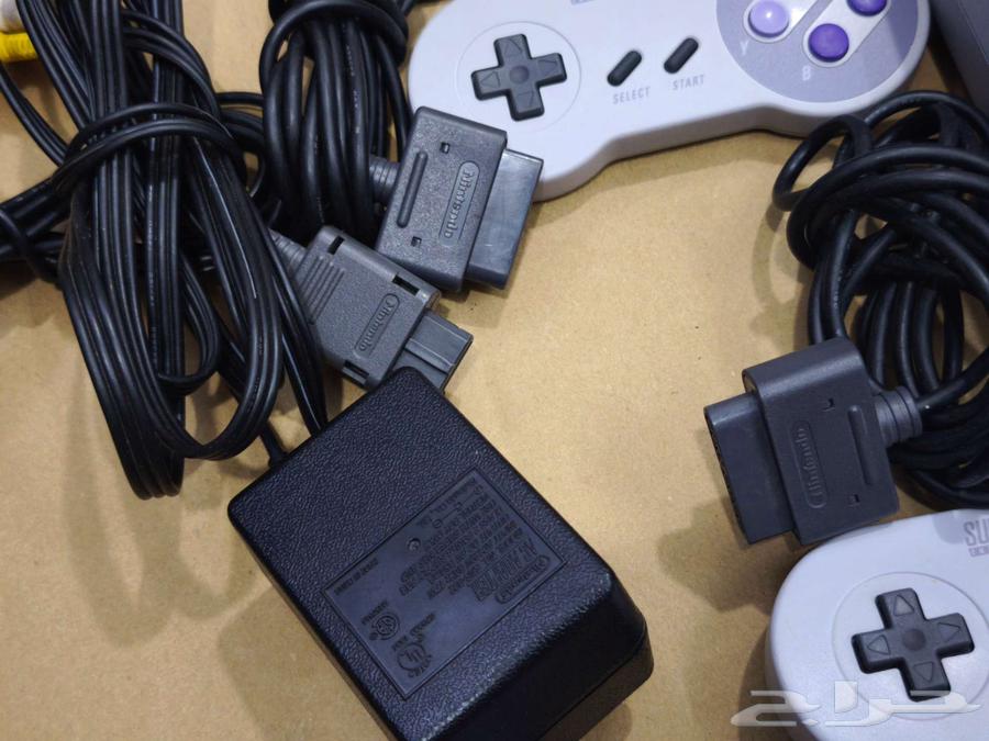 تم البيع- جهاز سوبر نينتندو مع يدين و 23 شريط اصلي snes63331708857987113