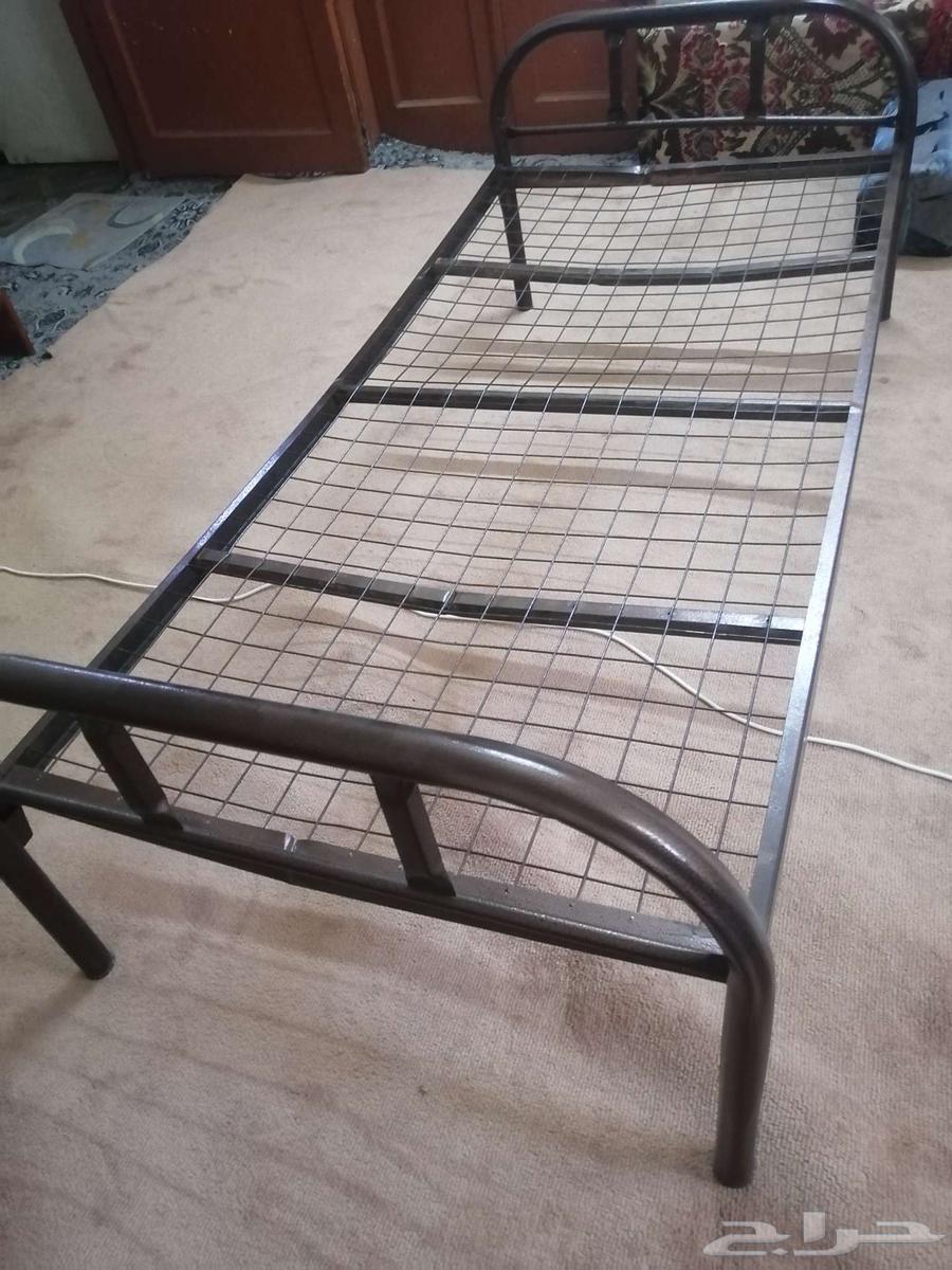 TV with a table with a bed63384128608769111