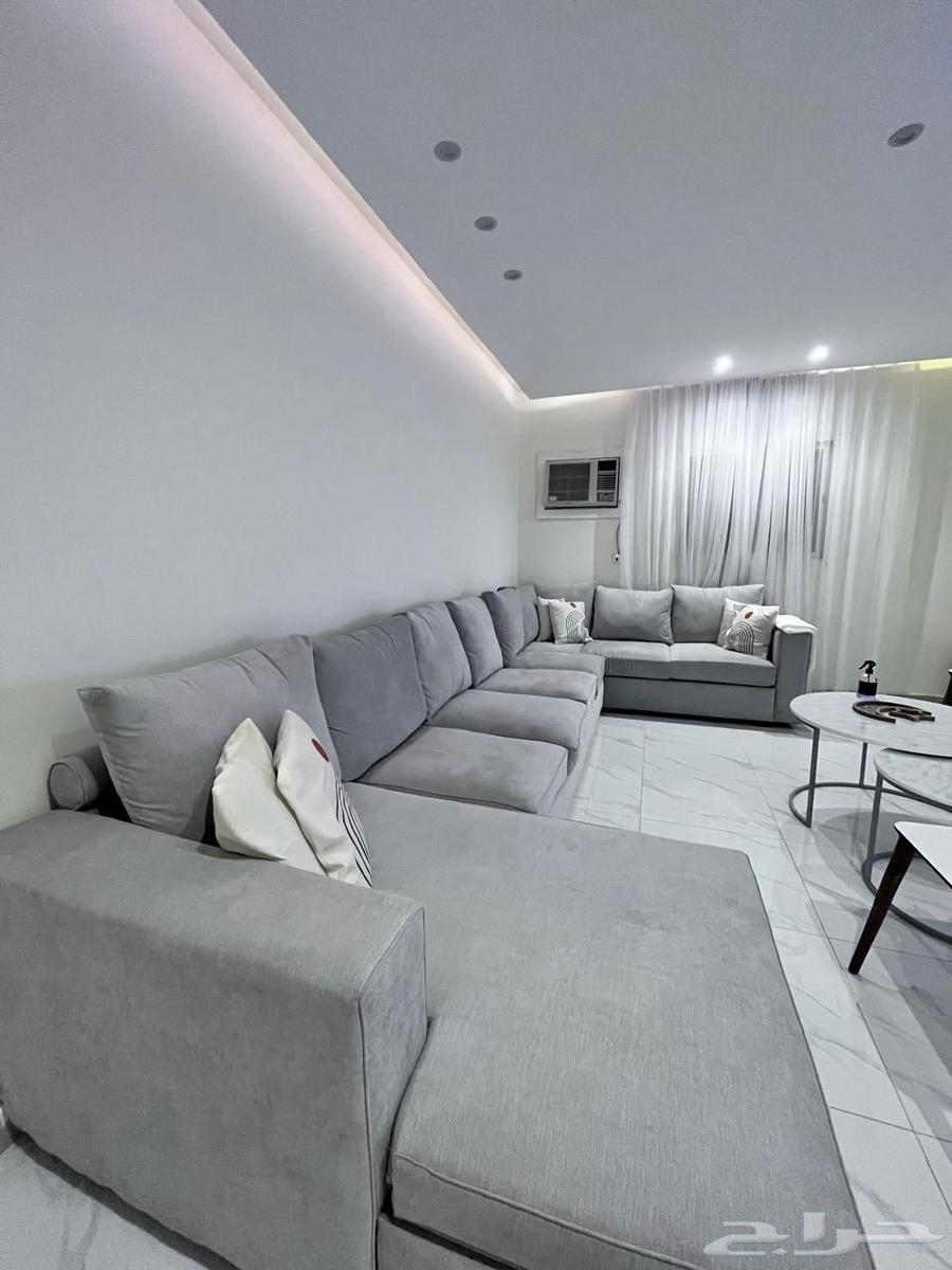 Sofa for sale with carpet, center table, and curtains63673067238787110