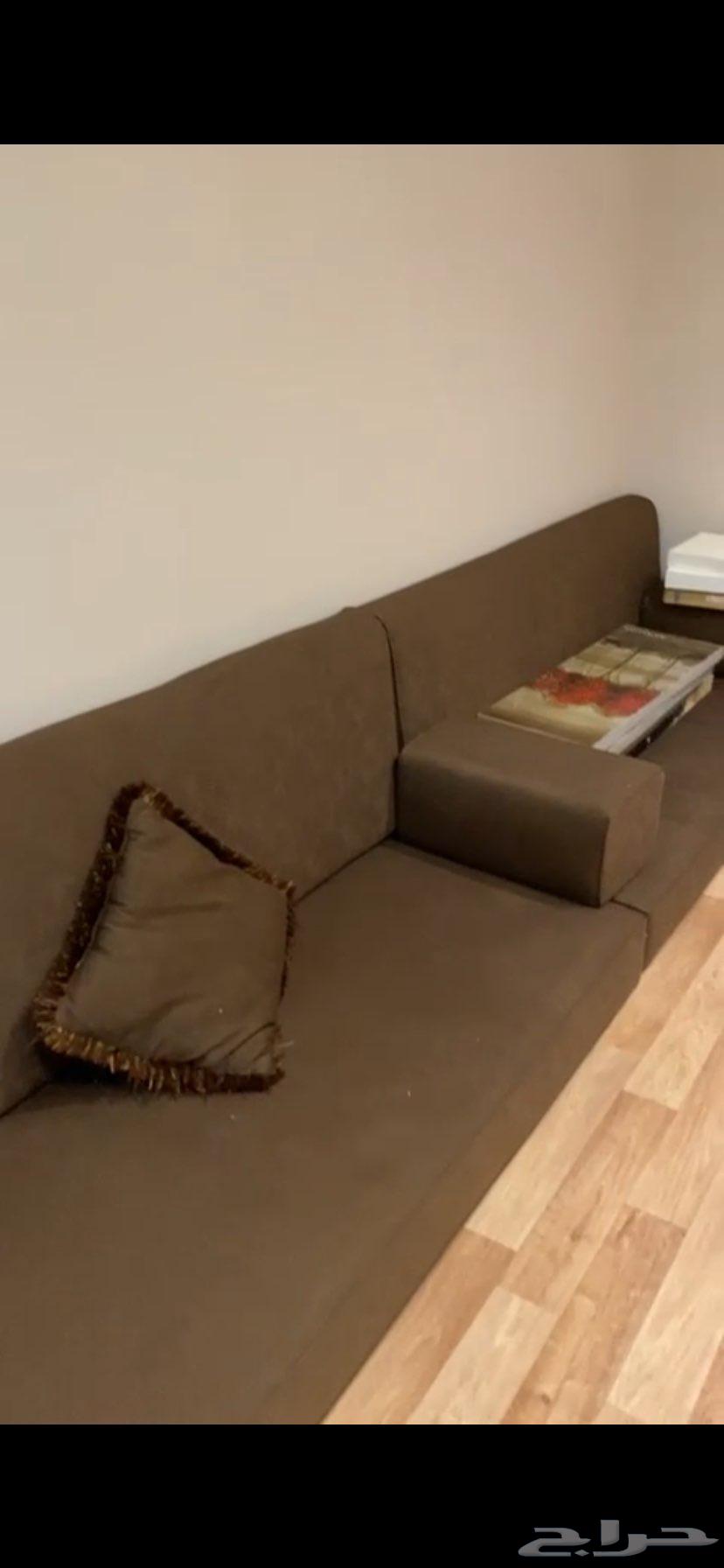 Large used sofa with curtain and large cushion in the same color63725717431169112