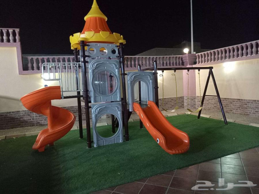 Outdoor children's playground with two swings and two slides 163721688856066110