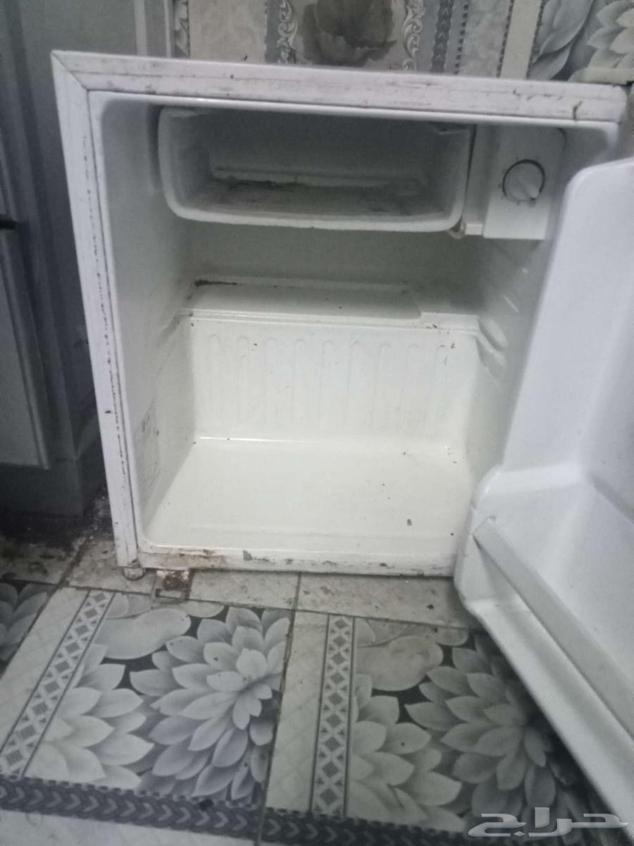 Mini fridge and two small tables63740284006531111