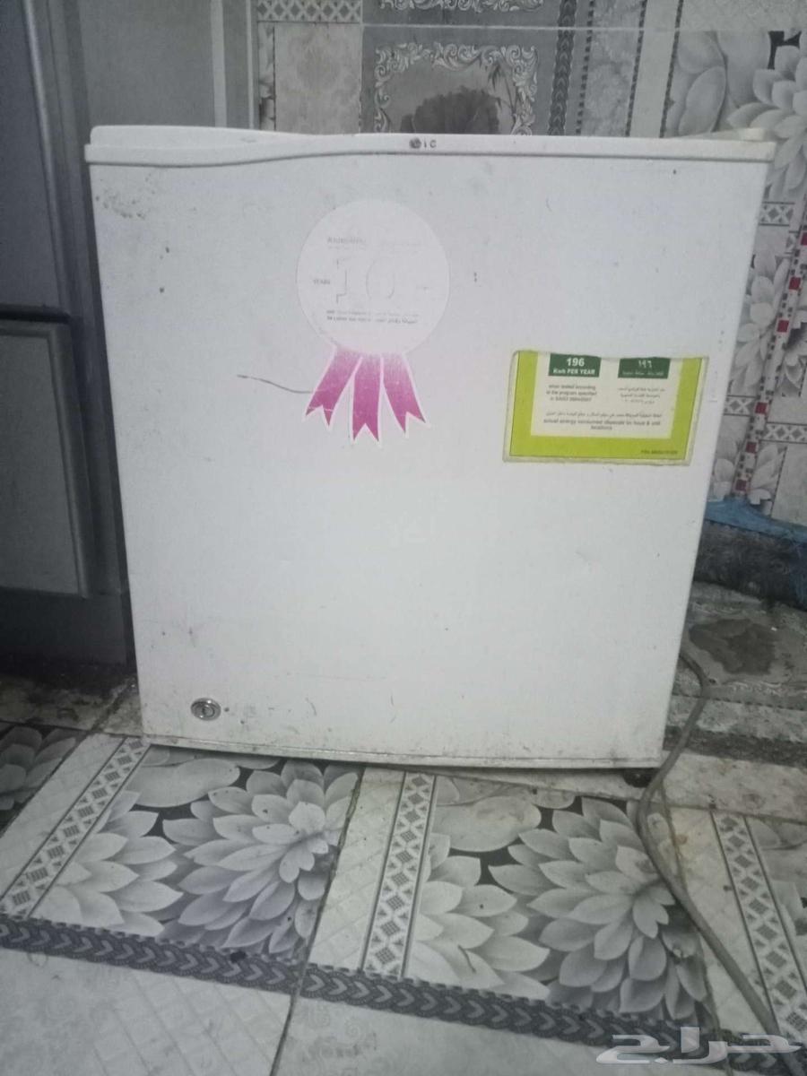 Mini fridge and two small tables63740284006531110