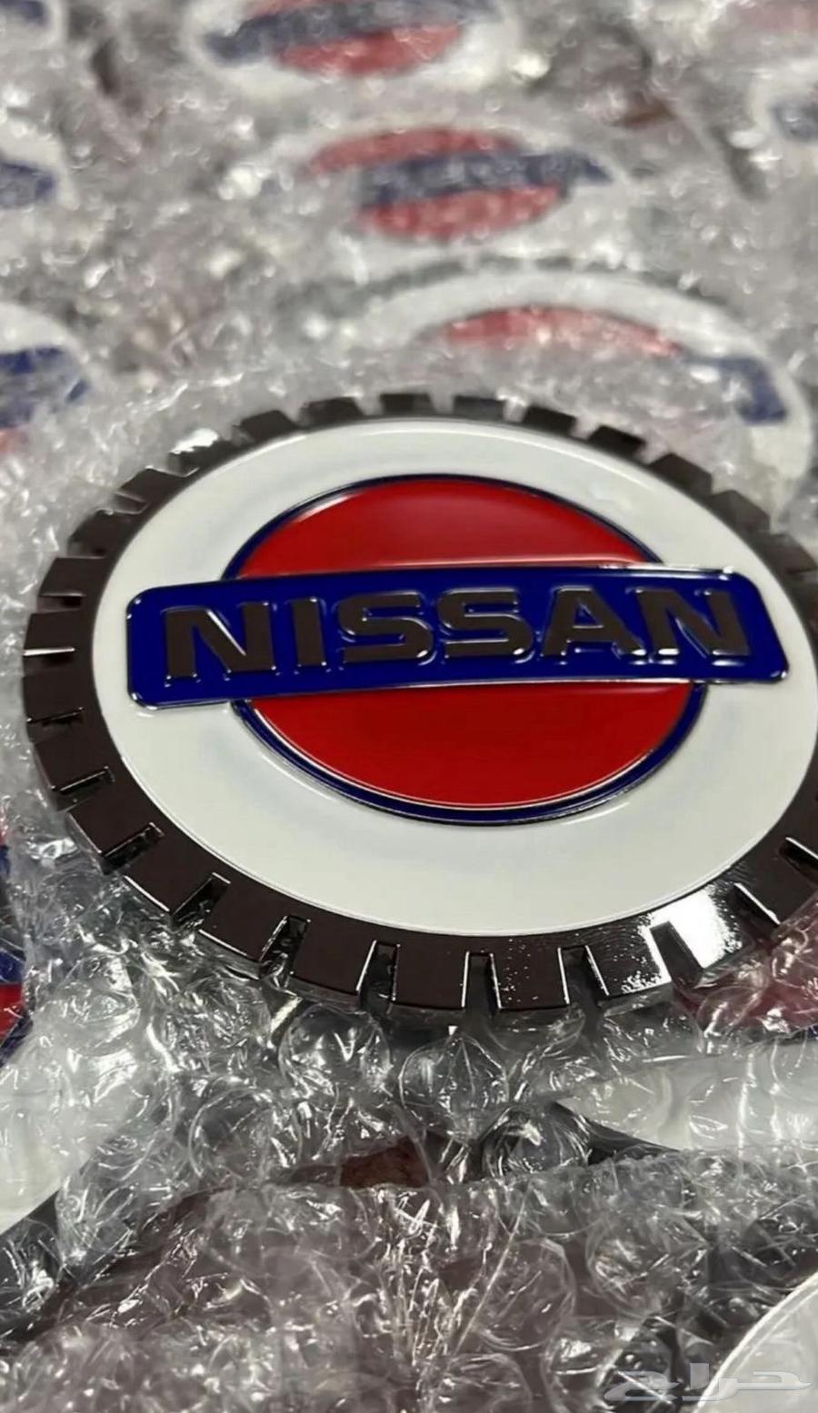 علامة شبك نيسان ذهبي و فضي64346960843138111