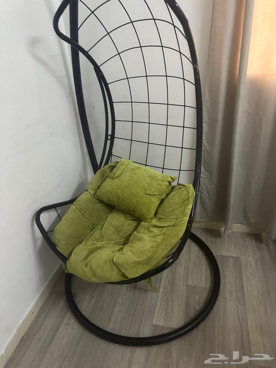 Dining table, sofa, and swing64368193245314110