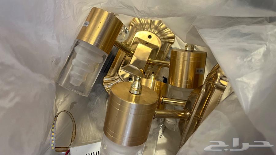 Small chandelier, two and several cushions and backrests sofa64430913856771114