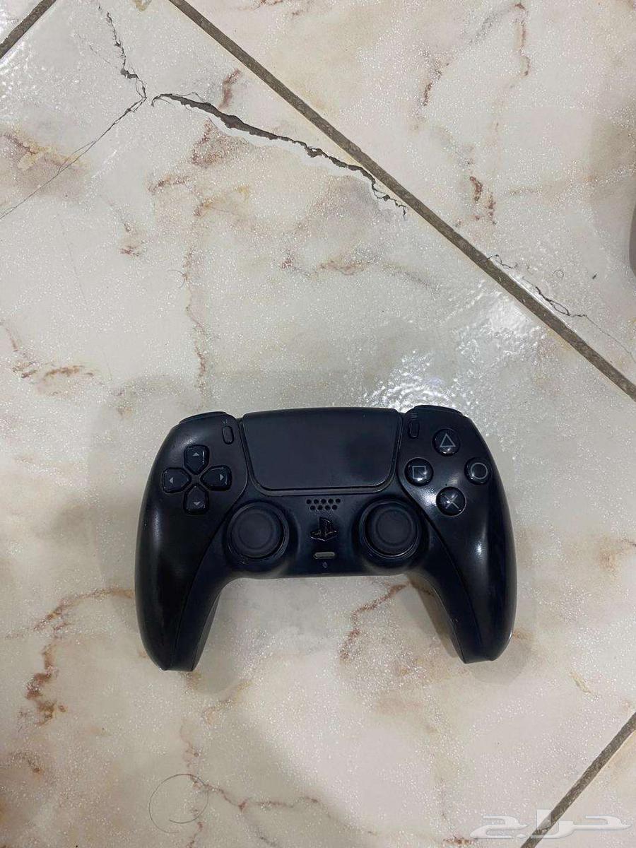 Two Sony 5 controllers, one white and one black, contact via WhatsApp64455290924929113