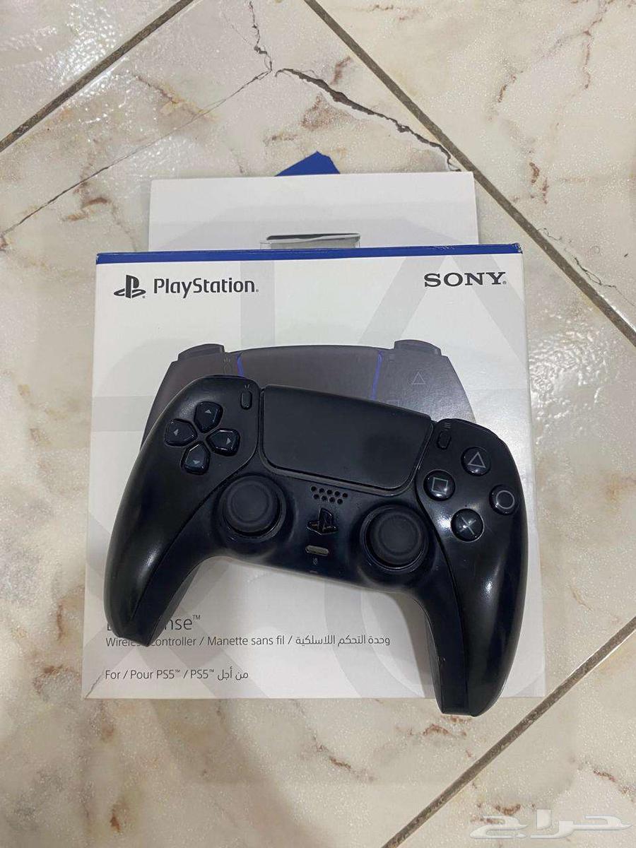 Two Sony 5 controllers, one white and one black, contact via WhatsApp64455290924929112