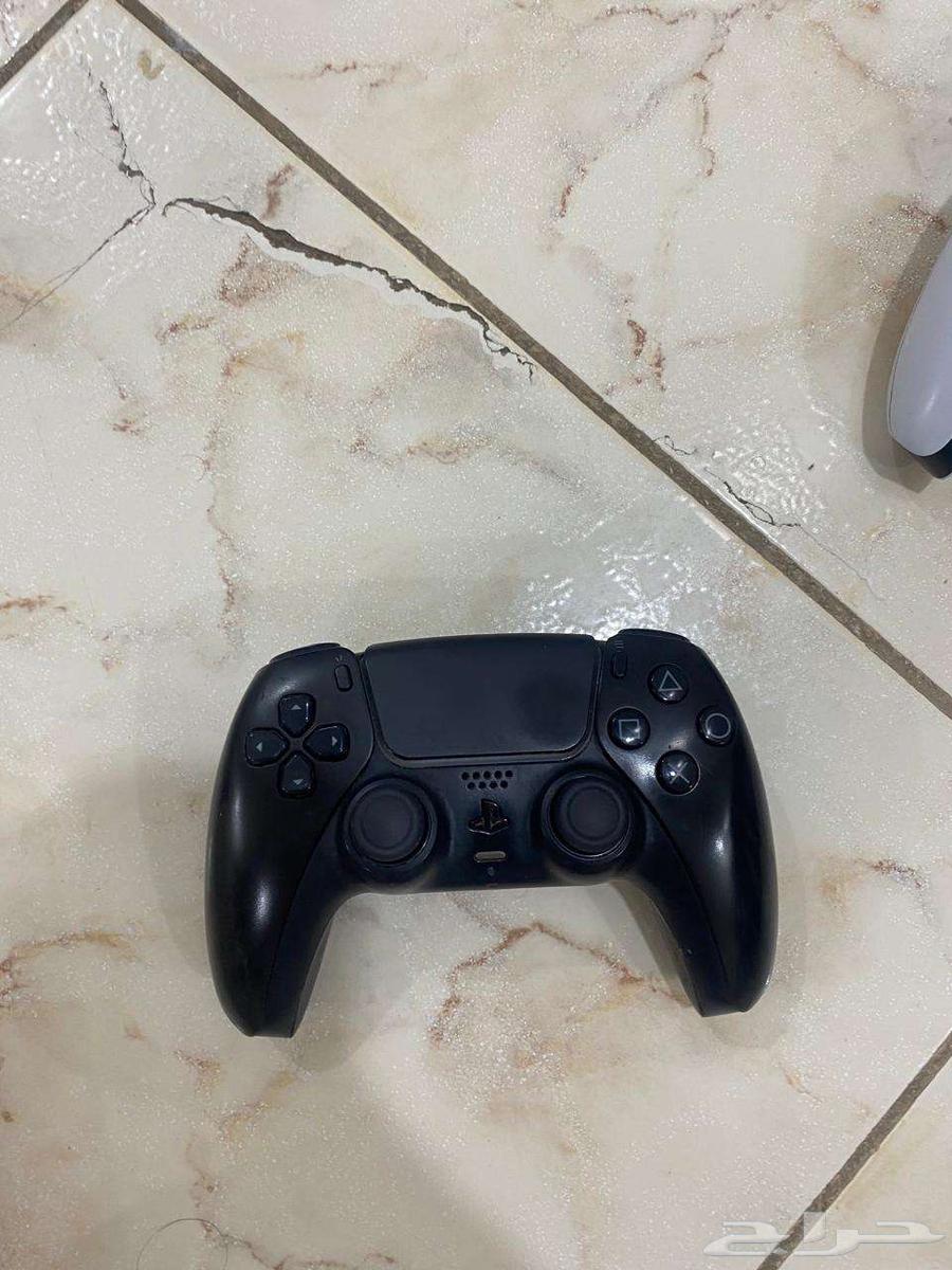 Two Sony 5 controllers, one white and one black, contact via WhatsApp64455290924929110