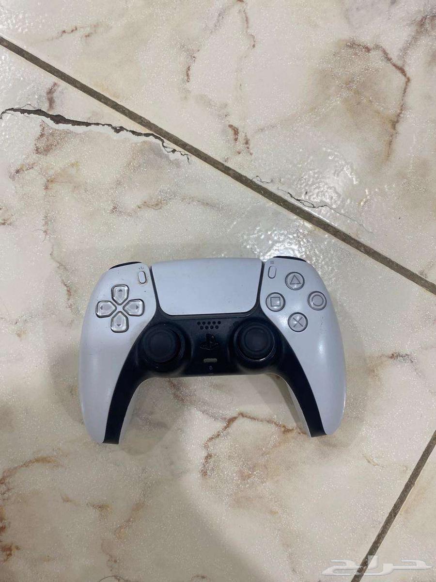 Two Sony 5 controllers, one white and one black, contact via WhatsApp64455290924929111