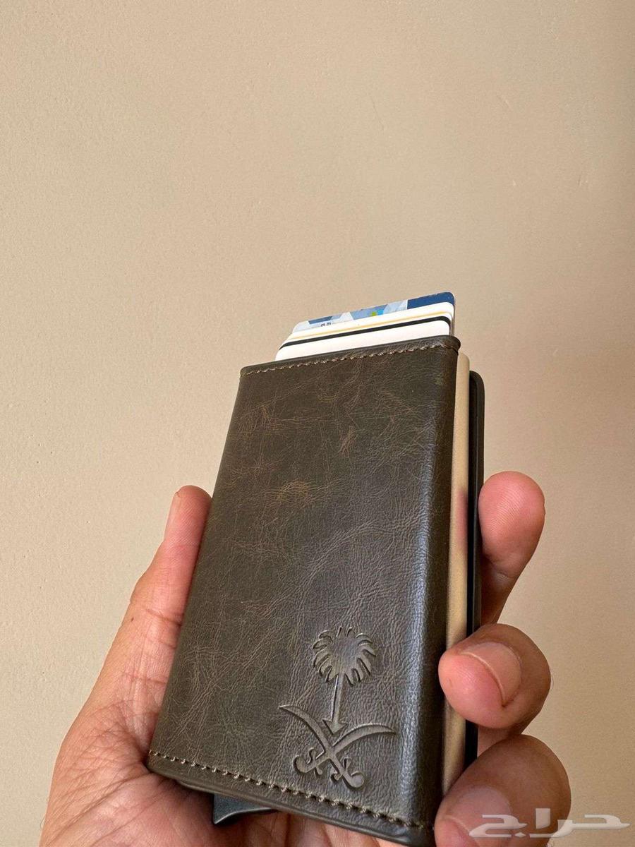 Royal wallet with luxury leather featuring royal emblem of two swords and palm tree64480758348546111