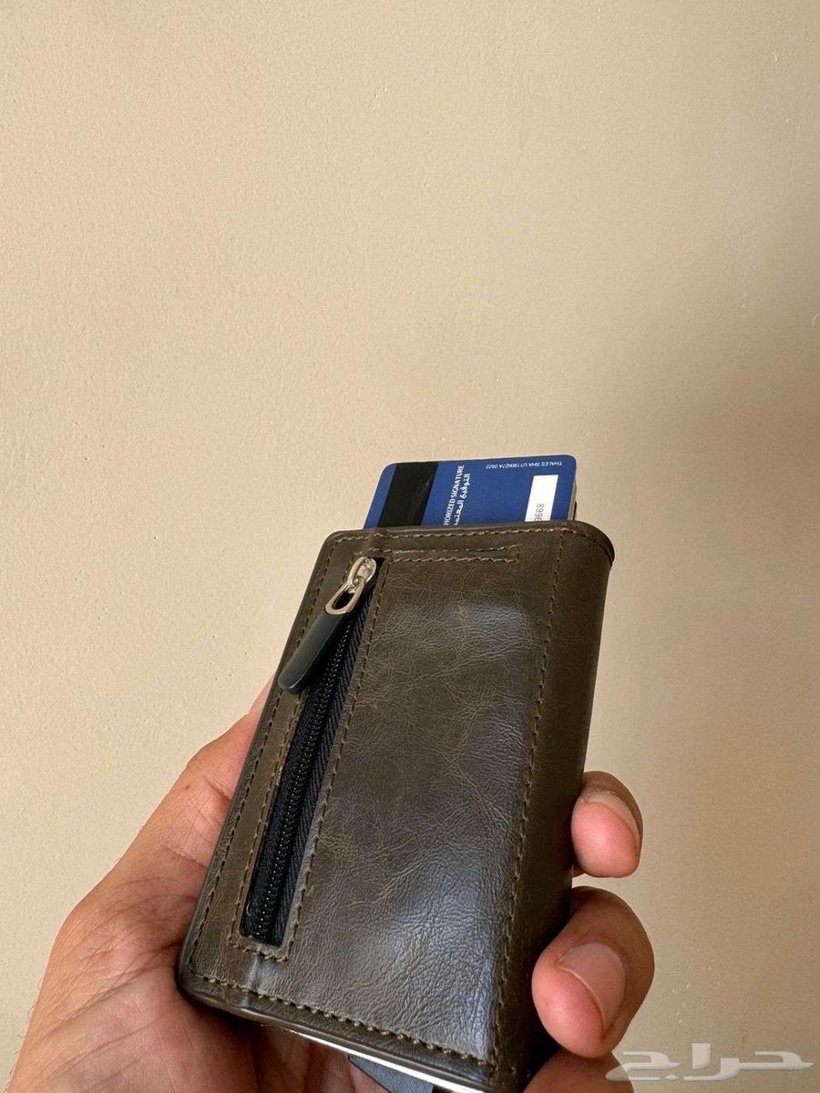 Royal wallet with luxury leather featuring royal emblem of two swords and palm tree64480758348546112