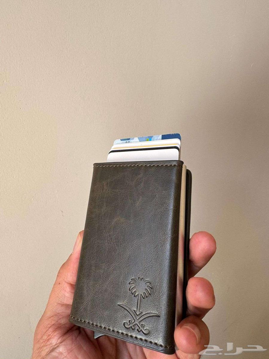 Royal wallet with luxury leather featuring royal emblem of two swords and palm tree64480758348546114