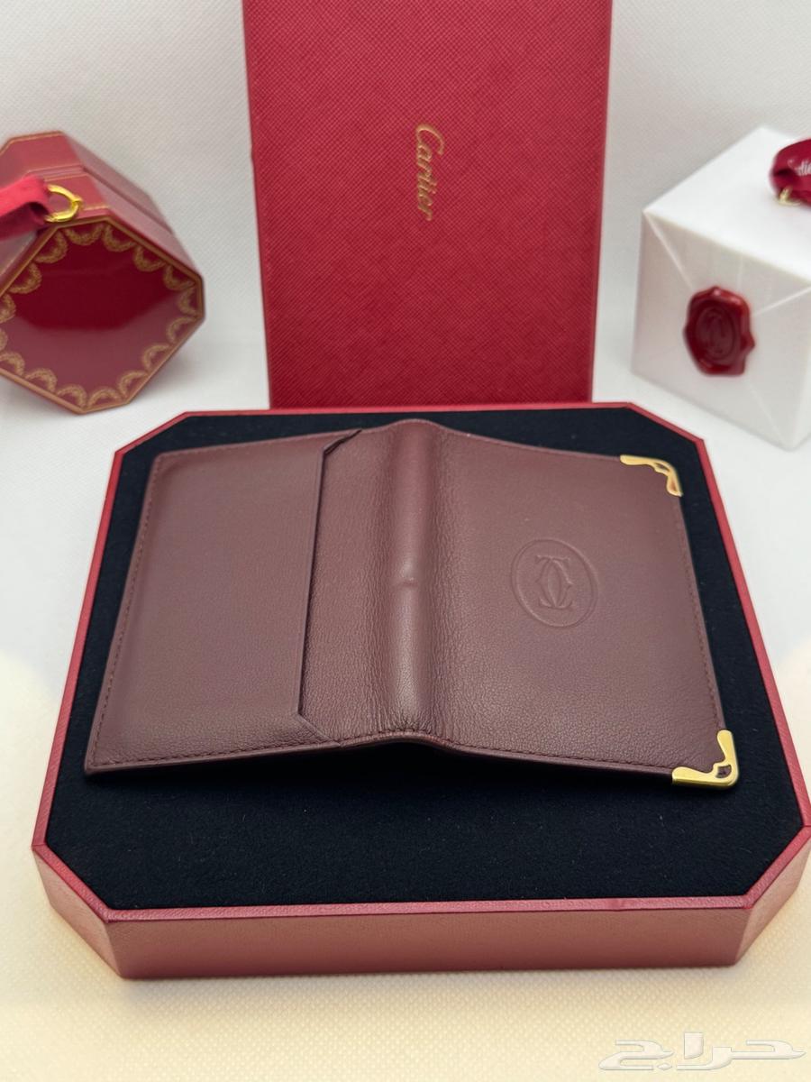 محفظة كارتير لون عنابي اصلية64503609864578113