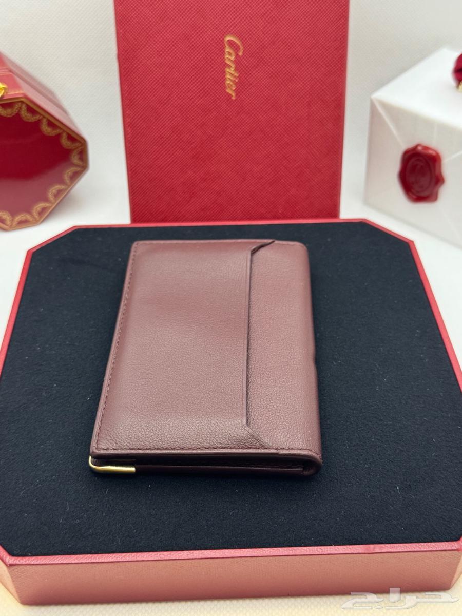 محفظة كارتير لون عنابي اصلية64503609864578112