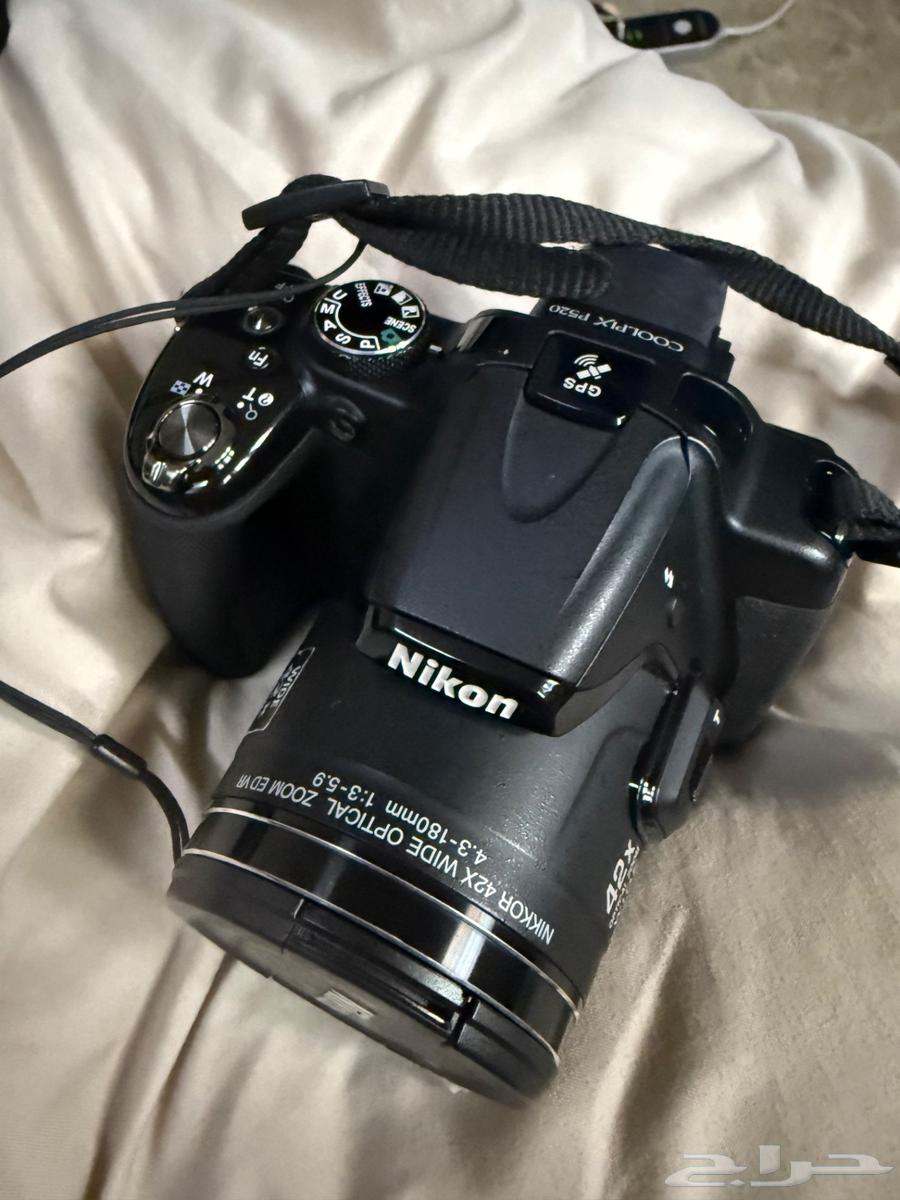 The camera shown in the image is a Nikon Coolpix64520572010371110