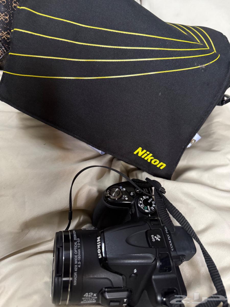 The camera shown in the image is a Nikon Coolpix64520572010371113