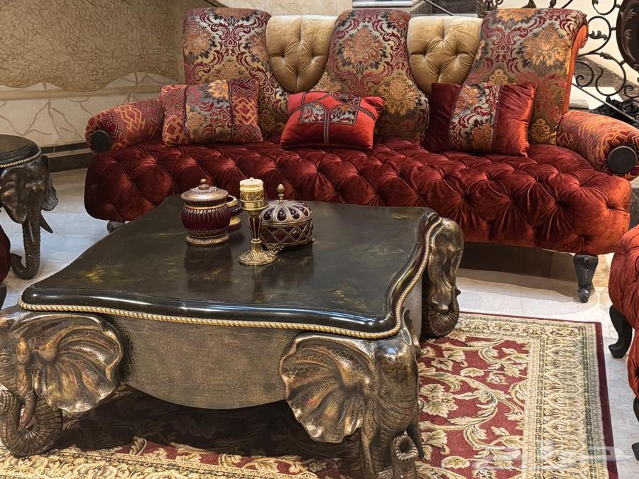 Luxurious sofa for sale with tables, accessories, and carpet64549191851139110
