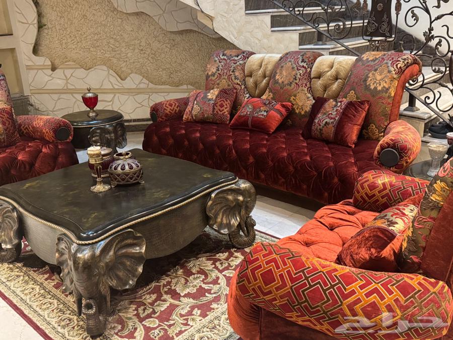 Luxurious sofa for sale with tables, accessories, and carpet64549191851139111