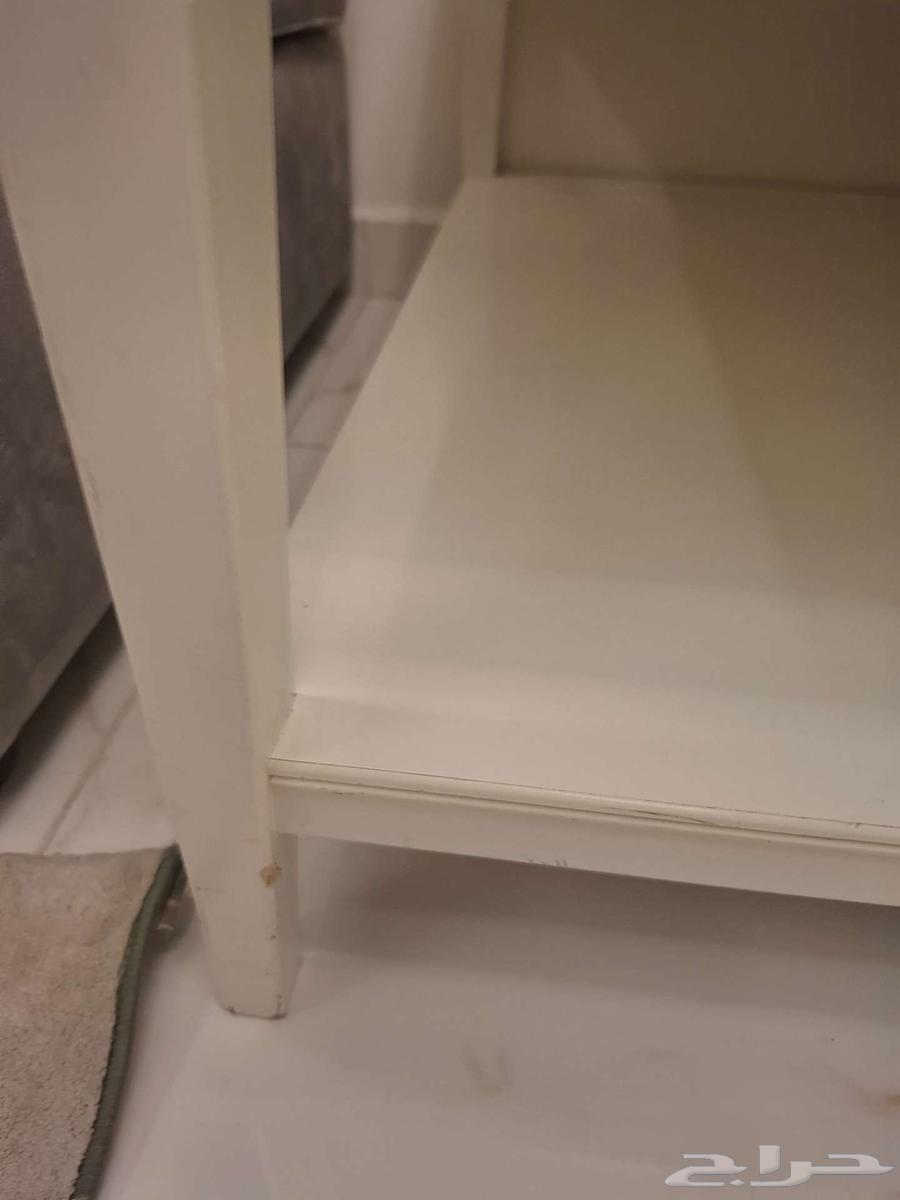 An IKEA table with some scratches64590189975810113