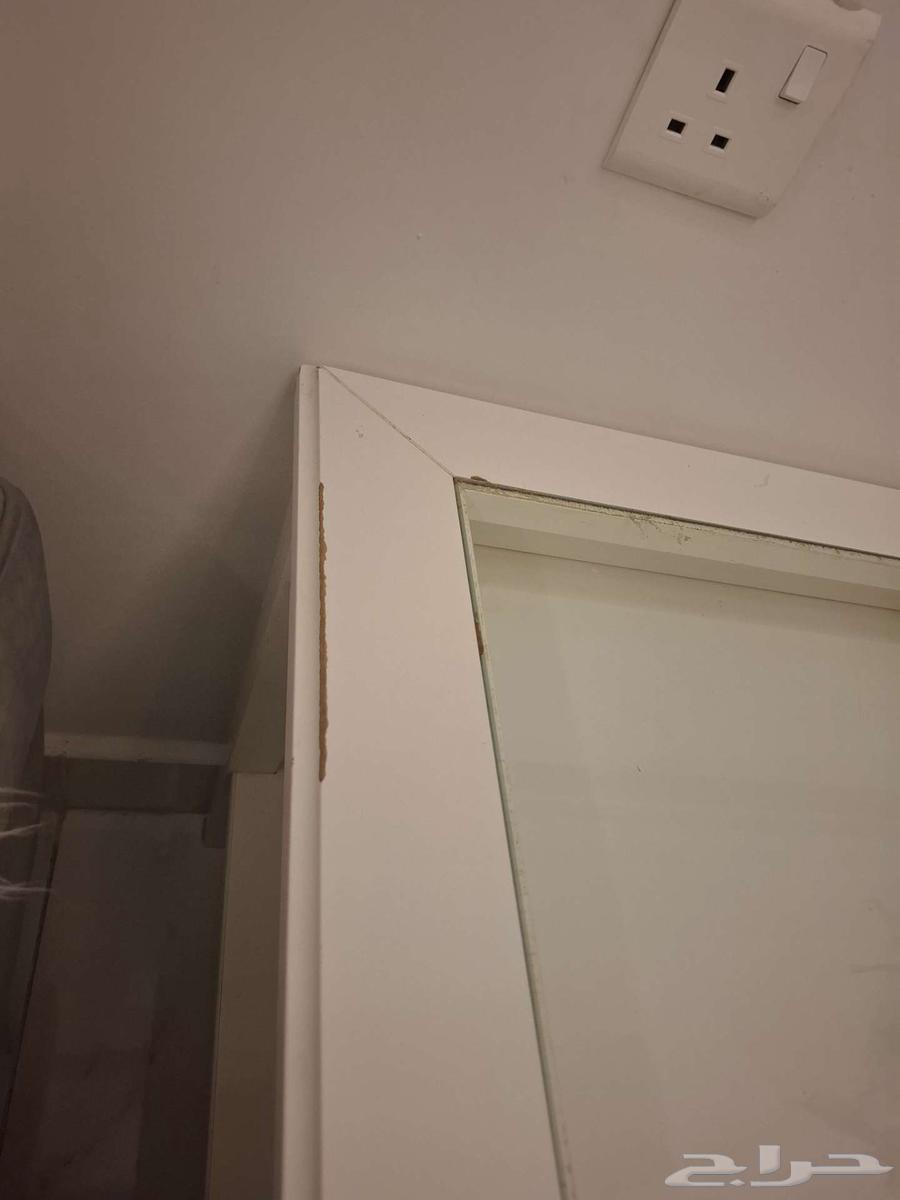 An IKEA table with some scratches64590189975810112