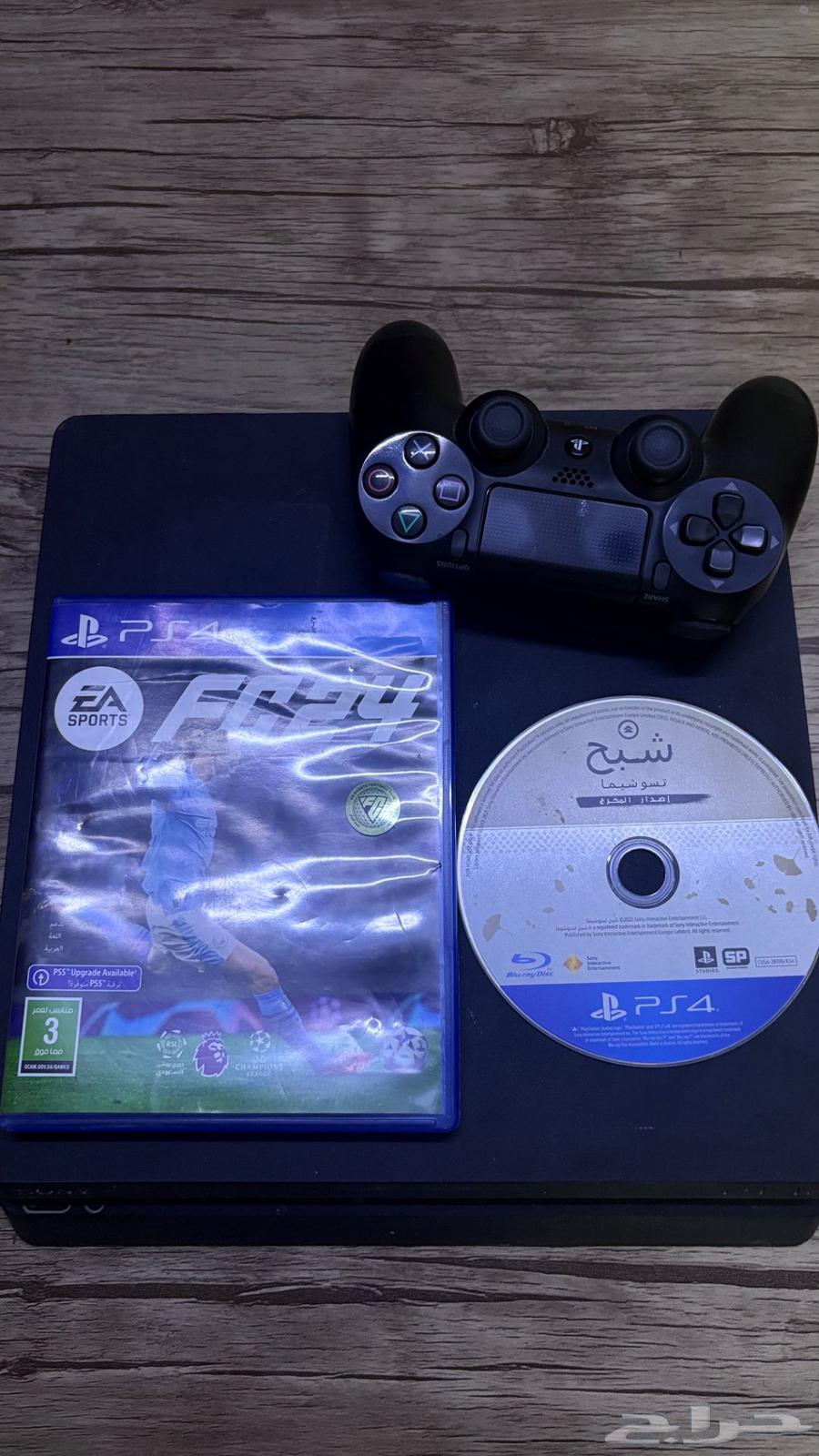 Sony 4 with controller and FIFA 24, 20, and Ghost of Tsushima tapes64570066966786110